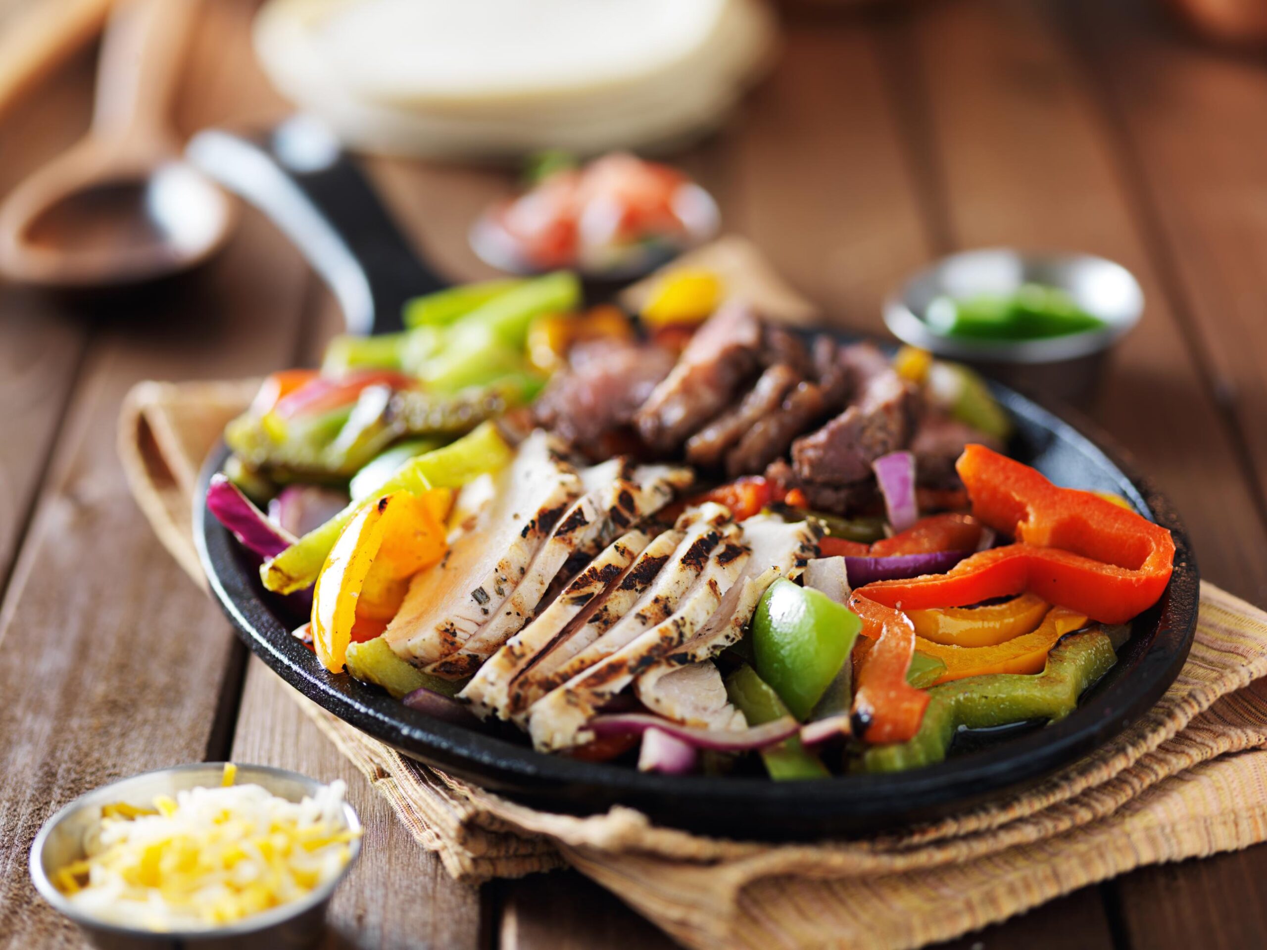 chicken-and-steak-mexican-fajitas-in-iron-skillet-2025-04-01-01-30-12-utc Chicken Fajitas - RPC