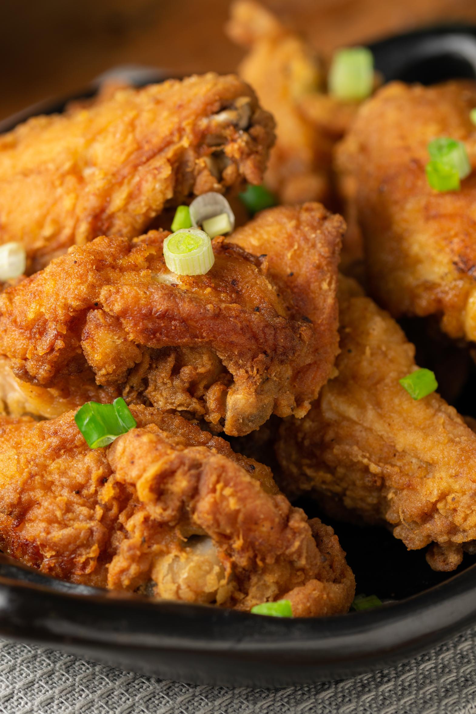 vertical-shot-of-a-plate-of-delicious-crispy-fried-2025-02-09-22-15-54-utc Plate of fried chicke